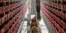 Stacker crane in high-bay warehouse aisle