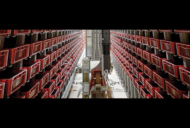 Stacker crane in high-bay warehouse aisle