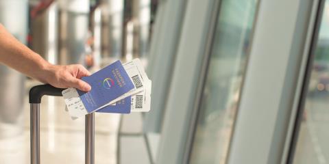 person holding a passport at the airport