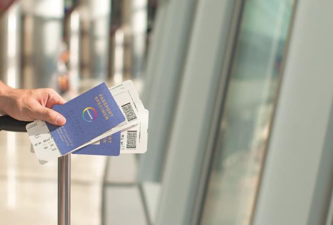 person holding a passport at the airport