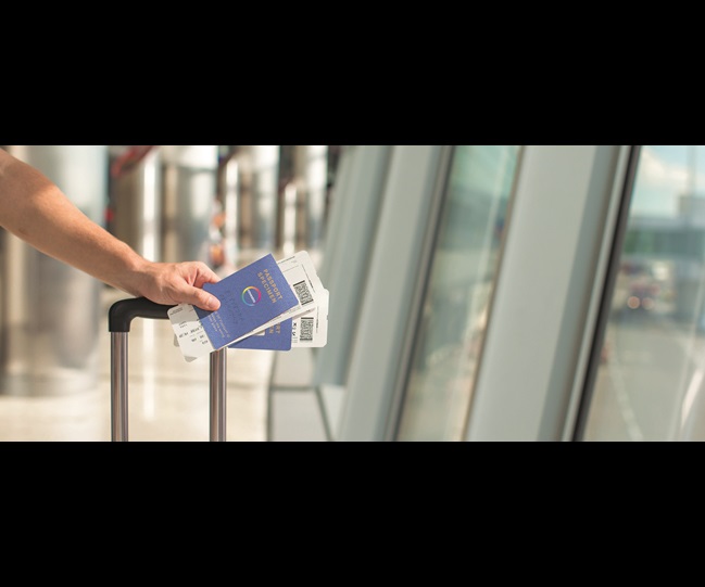 person holding a passport at the airport
