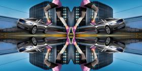 A kaleidoscope image displaying buildings, a car and a runner, mirroring its components starting from the center of the image.
