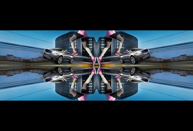 Ein Kaleidoskop Bild, das ein Gebäude, ein Auto und einen Läufer zeigt, wobei die Komponenten über die Mitte des Bildes gespiegelt werden.