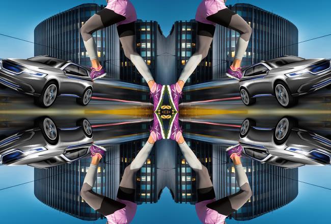 A kaleidoscope image displaying buildings, a car and a runner, mirroring its components starting from the center of the image.