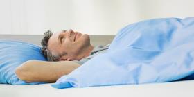 A man lying in bed.