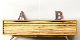 A sideboard shelf made of wood with two wooden letters on its top.
