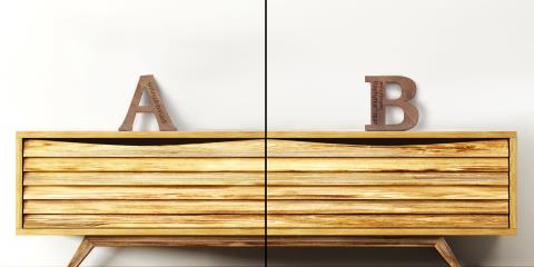 A sideboard shelf made of wood with two wooden letters on its top.