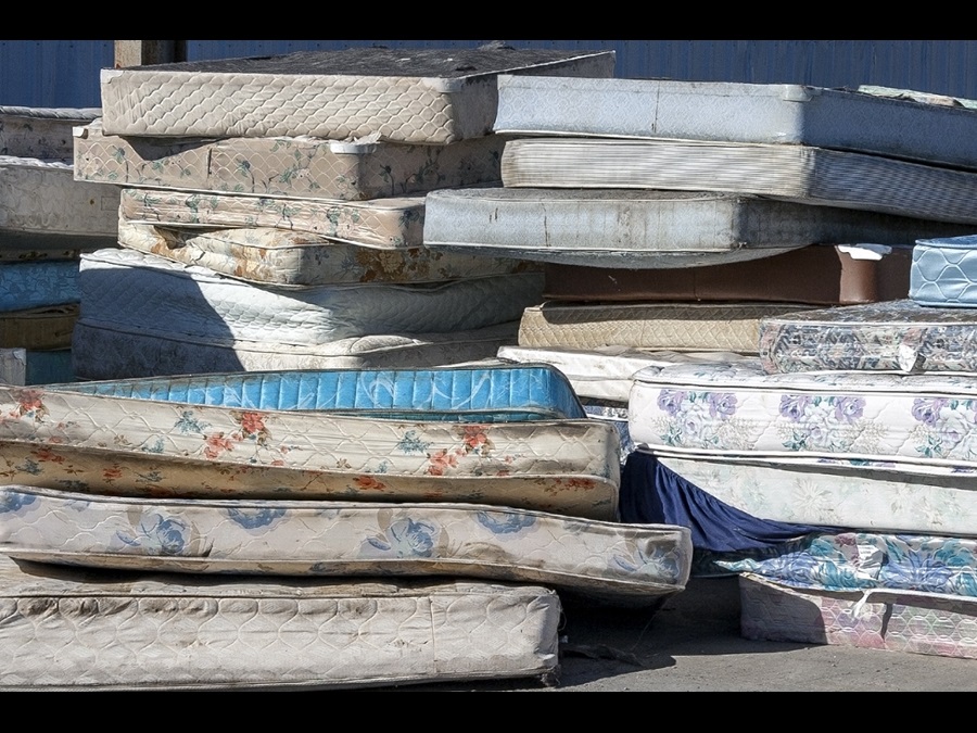 Image showing stack of discarded mattresses