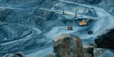 Open mine with excavation and transport vehicles
