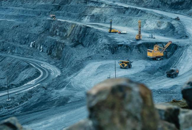 Open mine with excavation and transport vehicles