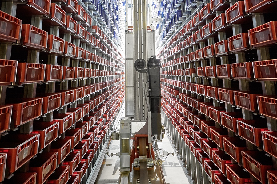 Stacker crane in high-bay warehouse aisle