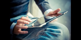 Young man is using a tablet
