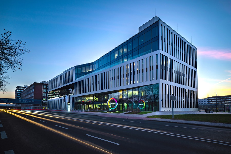 Front view of futuristic Covestro Campus building in Leverkusen in the evening.