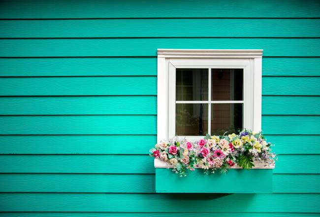 One window of wooden house, Decorated with fresh flowers