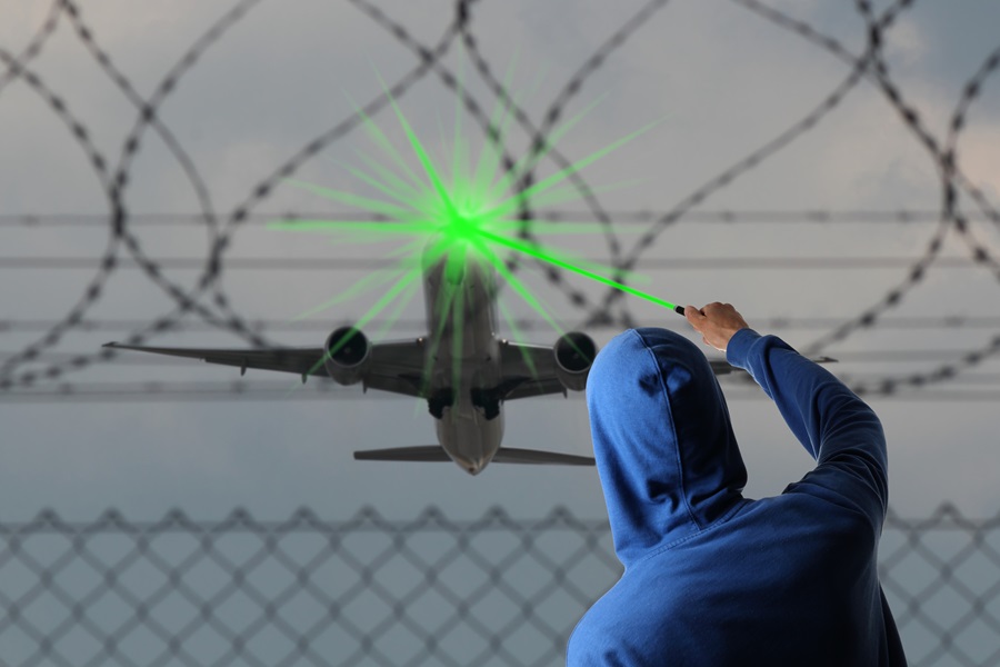 An aeroplane taking off and being glared with a laser pointer