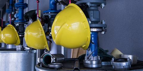 A row of yellow hard hats